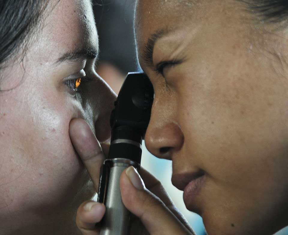 doctor looking into patients eye
